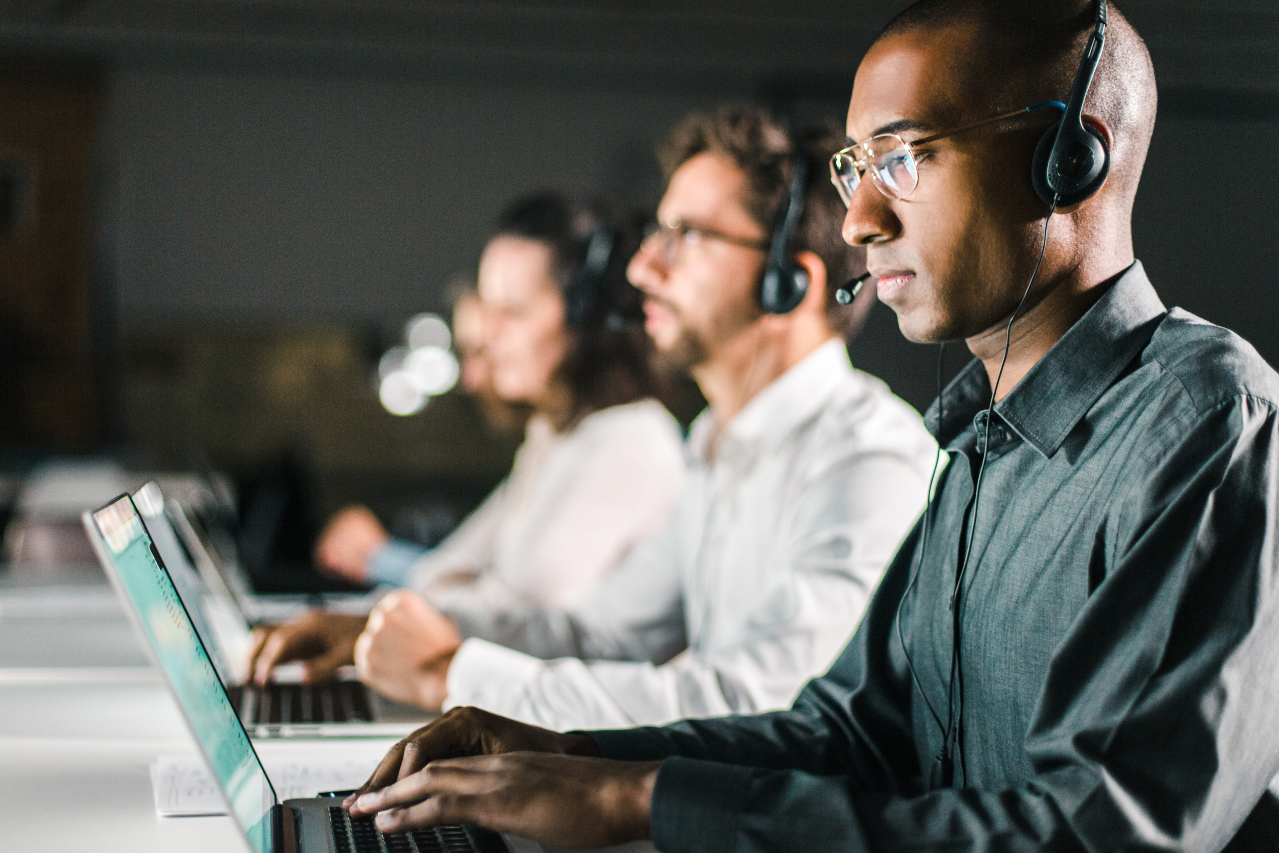 Side view of concentrated call center operator working